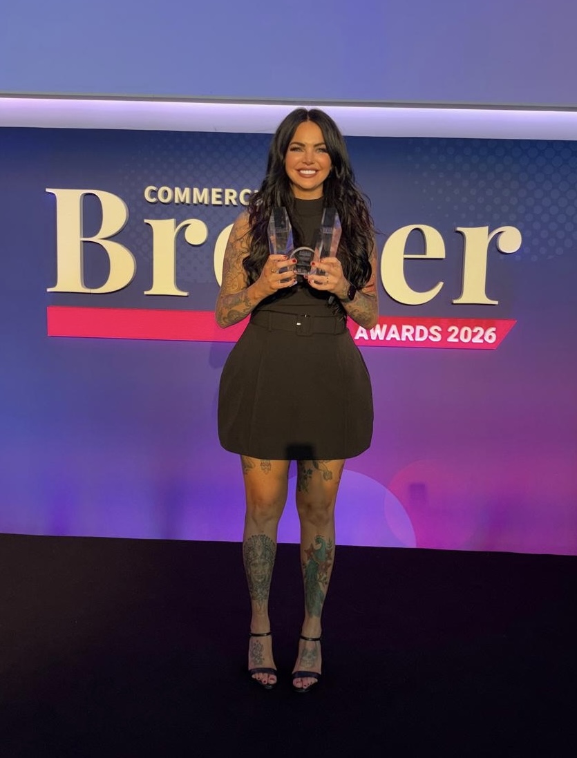 Emma Ross holding the Women’s Advocate Award 2026 at the NACFB Commercial Broker Awards